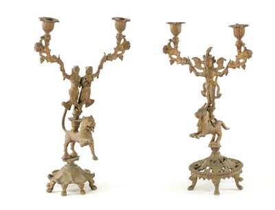 Lot 528 - A PAIR OF 19TH CENTURY GILT BRASS INDIAN CANDELABRA