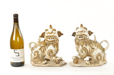 Lot 495 - A PAIR OF 19TH CENTURY CHINESE CERAMIC FOO DOGS
