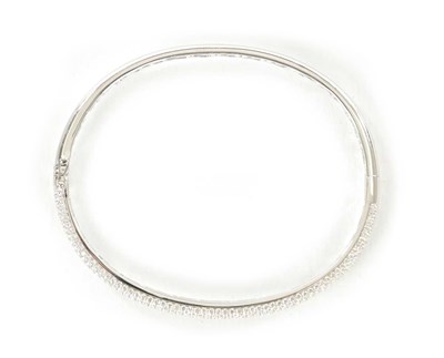 Lot 371 - AN 18CT WHITE GOLD AND DIAMON SET HINGED BANGLE