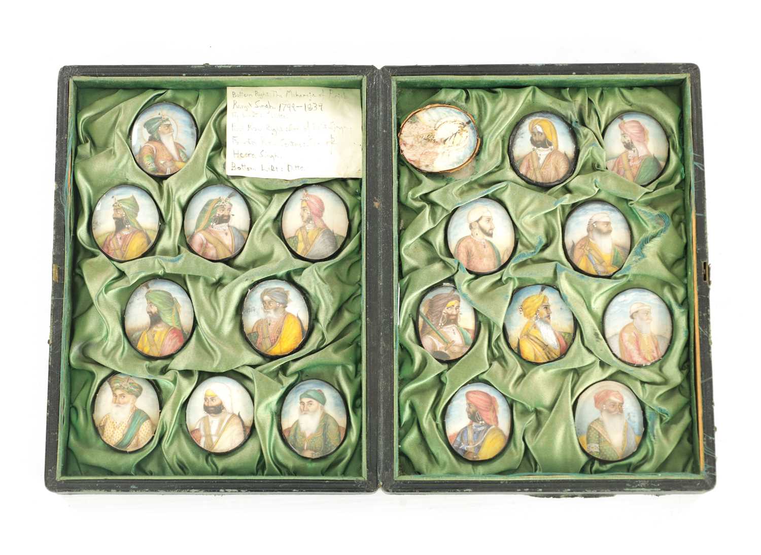 Lot 276 - A CASE GROUP OF NINETEEN PAINTED IVORY MINIATURE PORTRAITS OF THE INDIAN MAHARAJA OF PUNJAB