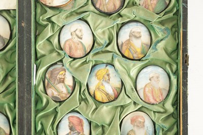 Lot 276 - A CASE GROUP OF NINETEEN PAINTED IVORY MINIATURE PORTRAITS OF THE INDIAN MAHARAJA OF PUNJAB