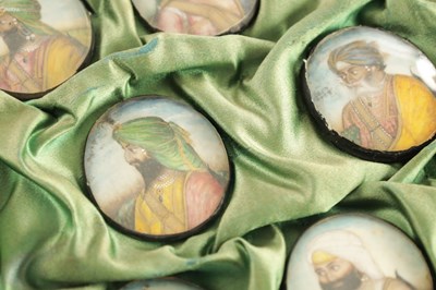 Lot 276 - A CASE GROUP OF NINETEEN PAINTED IVORY MINIATURE PORTRAITS OF THE INDIAN MAHARAJA OF PUNJAB