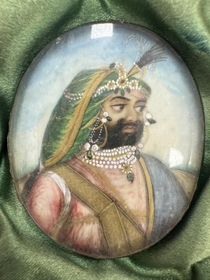 Lot 276 - A CASE GROUP OF NINETEEN PAINTED IVORY MINIATURE PORTRAITS OF THE INDIAN MAHARAJA OF PUNJAB