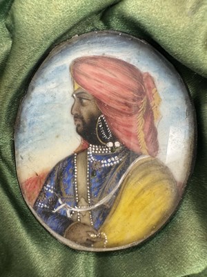 Lot 276 - A CASE GROUP OF NINETEEN PAINTED IVORY MINIATURE PORTRAITS OF THE INDIAN MAHARAJA OF PUNJAB
