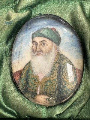 Lot 276 - A CASE GROUP OF NINETEEN PAINTED IVORY MINIATURE PORTRAITS OF THE INDIAN MAHARAJA OF PUNJAB