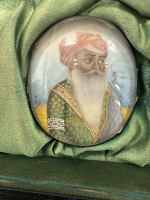 Lot 276 - A CASE GROUP OF NINETEEN PAINTED IVORY MINIATURE PORTRAITS OF THE INDIAN MAHARAJA OF PUNJAB