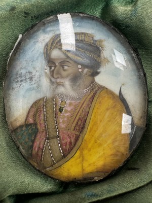 Lot 276 - A CASE GROUP OF NINETEEN PAINTED IVORY MINIATURE PORTRAITS OF THE INDIAN MAHARAJA OF PUNJAB
