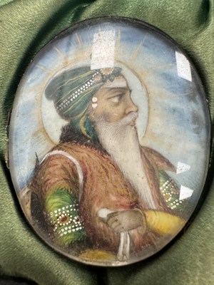 Lot 276 - A CASE GROUP OF NINETEEN PAINTED IVORY MINIATURE PORTRAITS OF THE INDIAN MAHARAJA OF PUNJAB