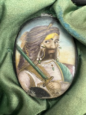 Lot 276 - A CASE GROUP OF NINETEEN PAINTED IVORY MINIATURE PORTRAITS OF THE INDIAN MAHARAJA OF PUNJAB