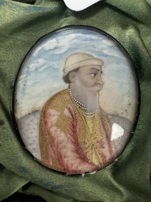 Lot 276 - A CASE GROUP OF NINETEEN PAINTED IVORY MINIATURE PORTRAITS OF THE INDIAN MAHARAJA OF PUNJAB