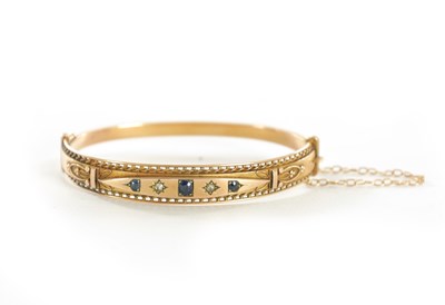 Lot 309 - A LADIES VINTAGE 9CT GOLD DIAMOND AND SAPPHIRE BANGLE