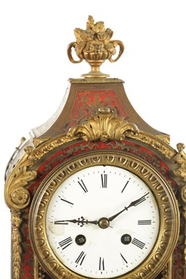 Lot 1050 - A LATE 19TH CENTURY FRENCH BOULLE SWINGING CHERUB MANTEL CLOCK