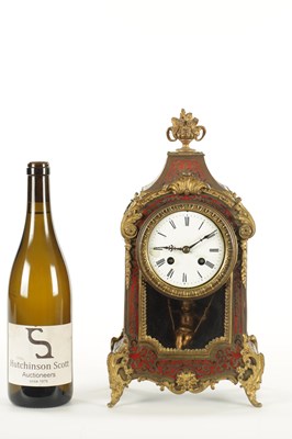 Lot 1050 - A LATE 19TH CENTURY FRENCH BOULLE SWINGING CHERUB MANTEL CLOCK