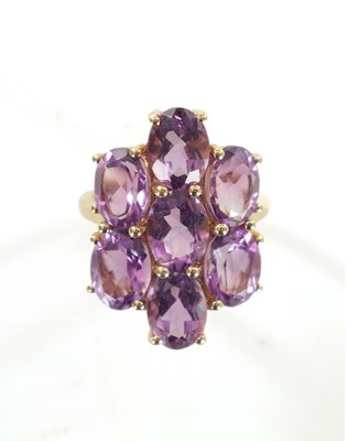 Lot 311 - A 10K YELLOW GOLD AMETHYST DRESS RING