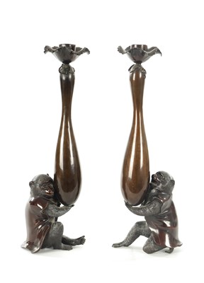 Lot 111 - A FINE PAIR OF JAPANESE MEIJI PATINATED BRONZE FIGURAL CANDLESTICKS