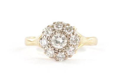 Lot 327 - AN 18CT GOLD NINE STONE DIAMOND DAISY RING