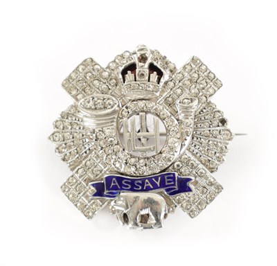 Lot 303 - A HIGHLAND LIGHT INFANTRY WHITE GOLD GEM SET AND ENAMEL MILITARY BROOCH