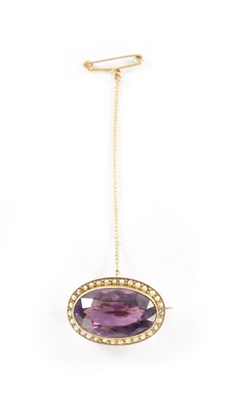 Lot 286 - A GOLD METAL AMETHYST AND PEARL BROOCH