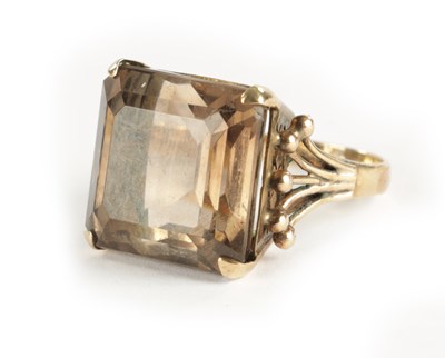 Lot 319 - A LARGE 9CT GOLD SMOKEY QUARTZ RING