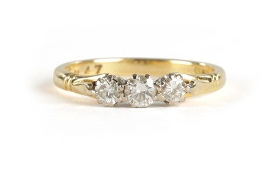 Lot 296 - AN 18CT GOLD THREE STONE DIAMOND RING