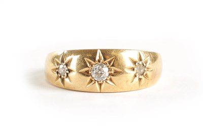 Lot 305 - AN 18CT GOLD THREE STONE DIAMOND GIPSY RING