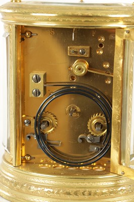 Lot 1028 - A LATE 19TH CENTURY FRENCH ENGRAVED OVAL CASED REPEATING CARRIAGE CLOCK