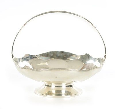Lot 404 - A GEORGE V HANDLED AND FOOTED SILVER BASKET