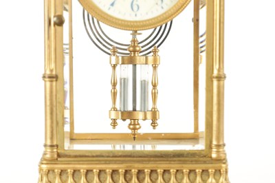 Lot 1090 - A LATE 19TH CENTURY GILT BRASS FOUR GLASS MANTEL CLOCK