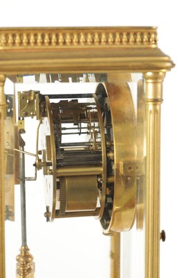 Lot 1090 - A LATE 19TH CENTURY GILT BRASS FOUR GLASS MANTEL CLOCK