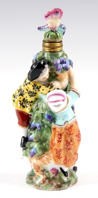 Lot 73 - A CONTINENTAL PORCELAIN SCENT BOTTLE modelled...