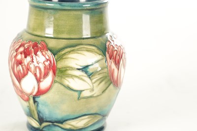 Lot 31 - A WILLIAM MOORCROFT MINIATURE 'WARATAH' CABINET VASE