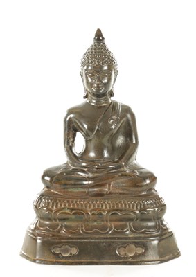 Lot 254 - AN EARLY CHINESE PATINATED BRONZE BUDDHA