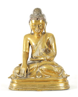 Lot 264 - AN 18TH CENTURY GILT BRONZE TIBETAN BUDDHA