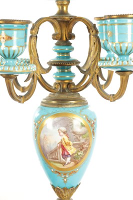 Lot 1106 - A 19TH CENTURY SERVES STYLE FRENCH PORCELAIN AND ORMOLU THREE-PIECE CLOCK GARNITURE