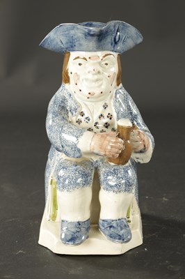 Lot 117 - AN EARLY 18TH CENTURY STAFFORDSHIRE TOBY JUG