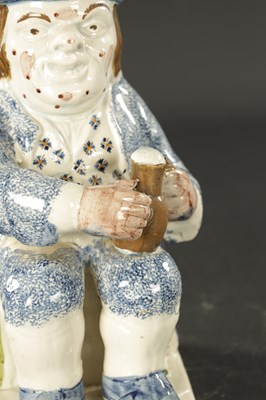 Lot 117 - AN EARLY 18TH CENTURY STAFFORDSHIRE TOBY JUG