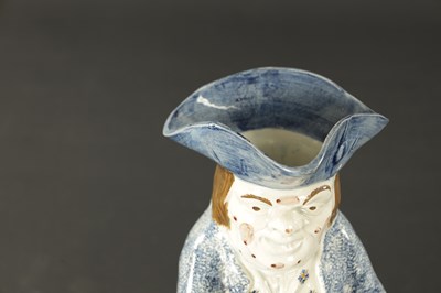 Lot 117 - AN EARLY 18TH CENTURY STAFFORDSHIRE TOBY JUG