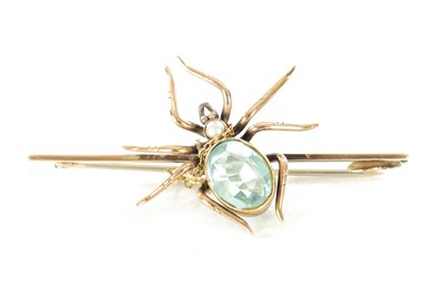 Lot 470 - A 9CT ROSE GOLD AND AQUAMARINE SPIDER BAR BROOCH