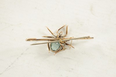 Lot 470 - A 9CT ROSE GOLD AND AQUAMARINE SPIDER BAR BROOCH