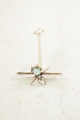 Lot 470 - A 9CT ROSE GOLD AND AQUAMARINE SPIDER BAR BROOCH
