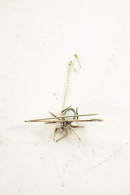 Lot 470 - A 9CT ROSE GOLD AND AQUAMARINE SPIDER BAR BROOCH