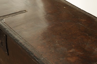Lot 834 - A LARGE EARLY 17TH CENTURY OAK SIX PLANK COFFER