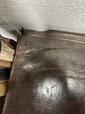 Lot 834 - A LARGE EARLY 17TH CENTURY OAK SIX PLANK COFFER