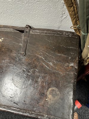 Lot 834 - A LARGE EARLY 17TH CENTURY OAK SIX PLANK COFFER