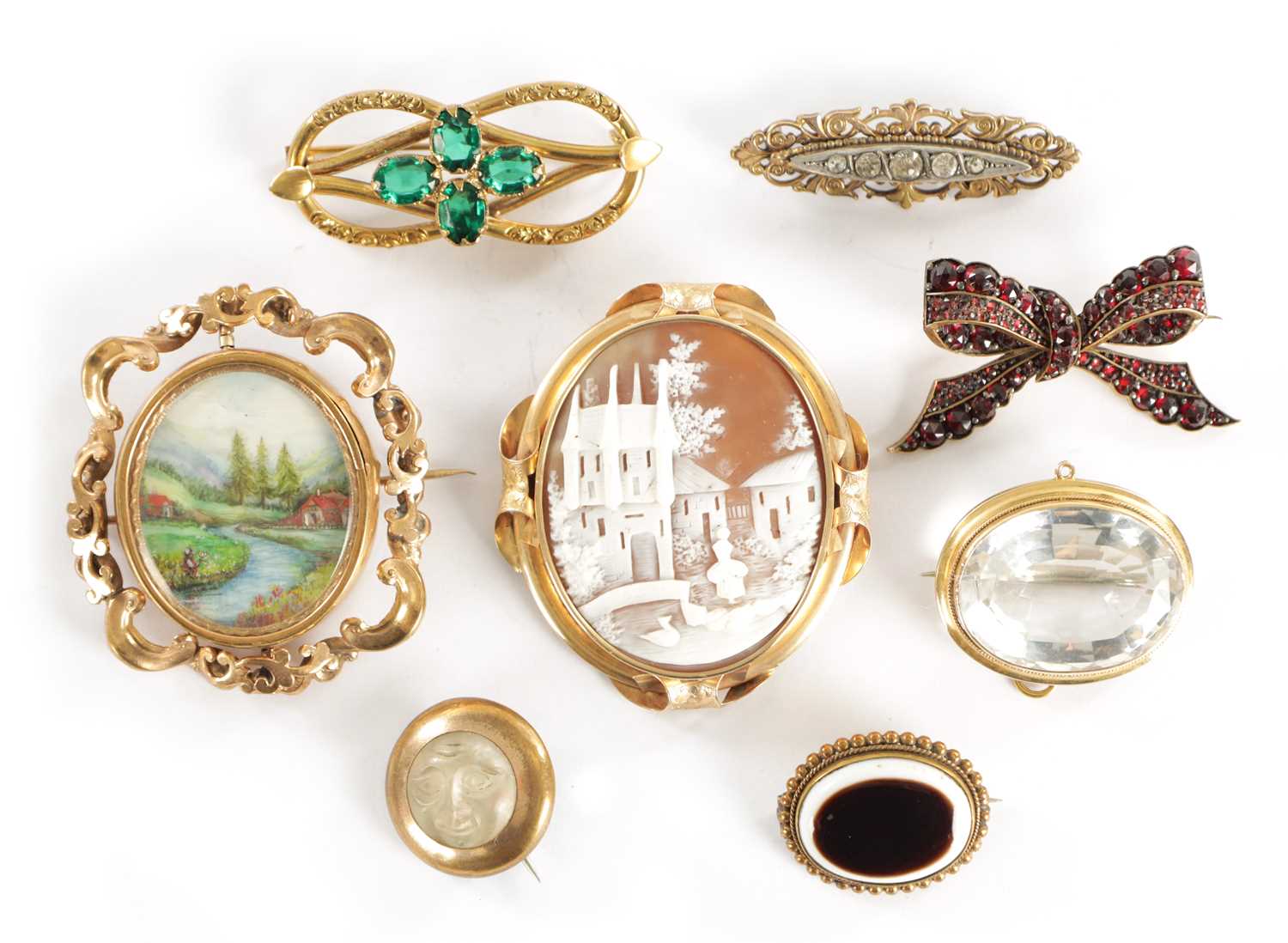 Lot 455 - A COLLECTION OF EIGHT 19TH CENTURY GILT METAL BROOCHES
