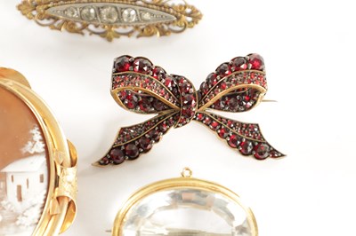 Lot 455 - A COLLECTION OF EIGHT 19TH CENTURY GILT METAL BROOCHES