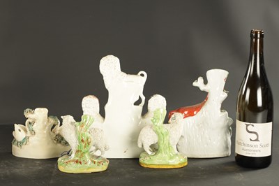 Lot 170 - A STAFFORDSHIRE CLOCK GROUP OF SPANIELS AND POODLE