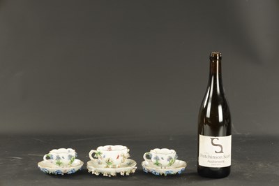 Lot 34 - THREE MID 19TH CENTURY MEISSEN PORCELAIN CUP AND SAUCERS