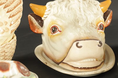 Lot 338 - A MID 19TH CENTURY STAFFORDSHIRE BULLS HEAD TONGUE STAND AND COVER