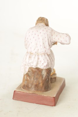 Lot 35 - A RUSSIAN IMPERIAL SEATED FIGURE OF A COBBLER